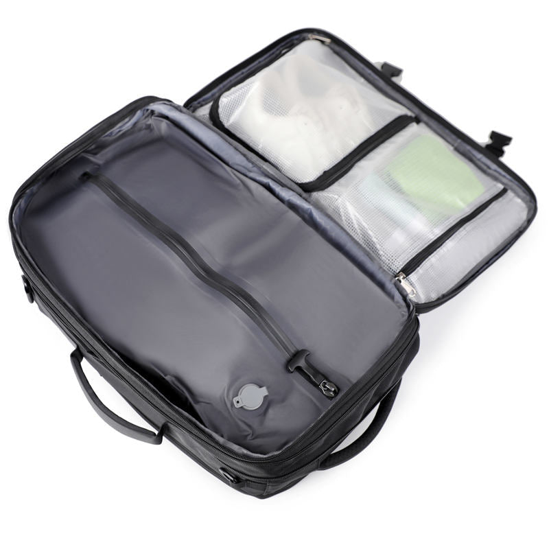 CompressX Go carry-on backpack showing vacuum storage compartment