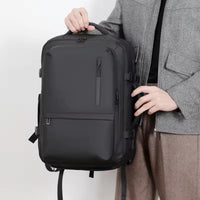 Person carrying Flex Shell Travel Laptop Backpack while travelling